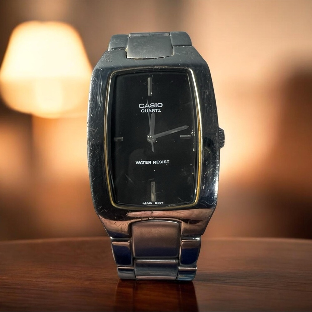 (172) Vintage Casio Black and Silver Rectangular Watch MTP 1165